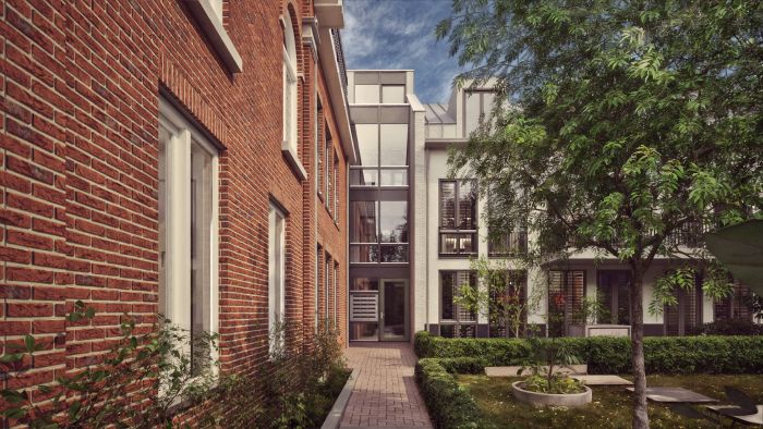 Impressie van binnenhof van nieuwbouwproject ’t Oude Raadhuis Ulestraten met tuin en moderne gevels.