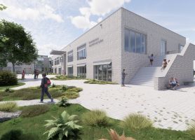 Kernkindcentrum Maastricht-West – impressie van schoolgebouw in licht baksteen met brede buitentrap, speelplein en groen inrichting