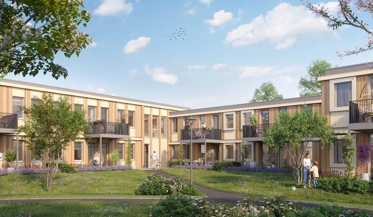 Woningbouw rond groene binnentuin met balkons, wandelpaden en bomen