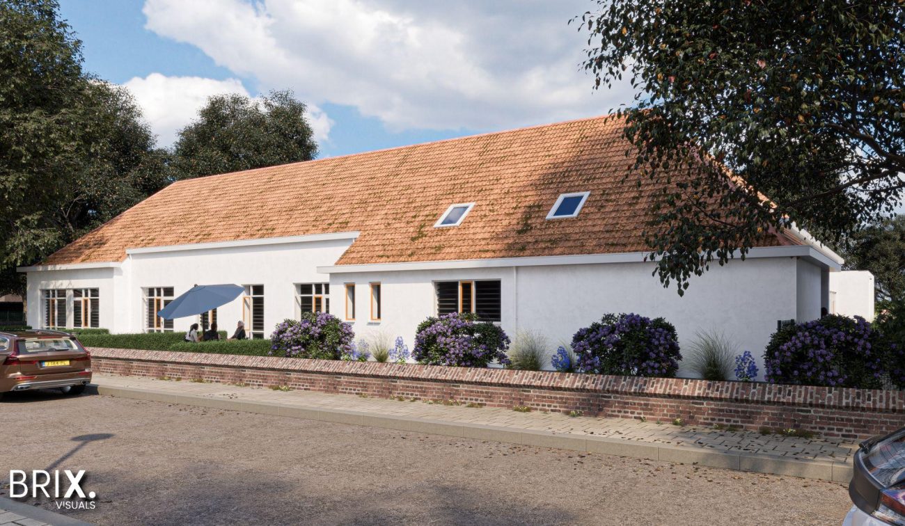 Transformatie oude school Buchten: wit gepleisterd gebouw met oranjerode pannen, lage muur en beplanting