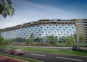 Impressie renovatie en optoppen flatgebouwen Breda: hoge gevel met glas, balkons en groen aan weg