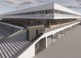 Bedrijfsgebouw met langgerekte glazen gevel, meerdere verdiepingen en verhoogd terras