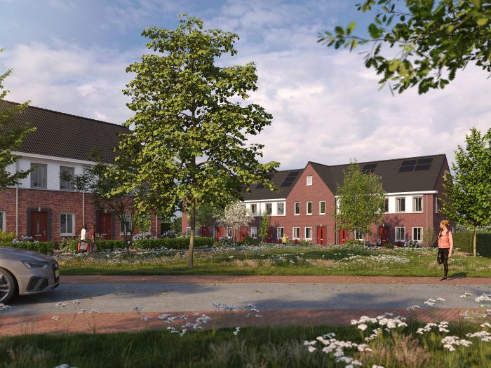 Overdagimpressie van de rijtjeswoningen in het nieuwbouwproject De Bloesemgaard in Margraten, met moderne gevels en groene voortuinen.